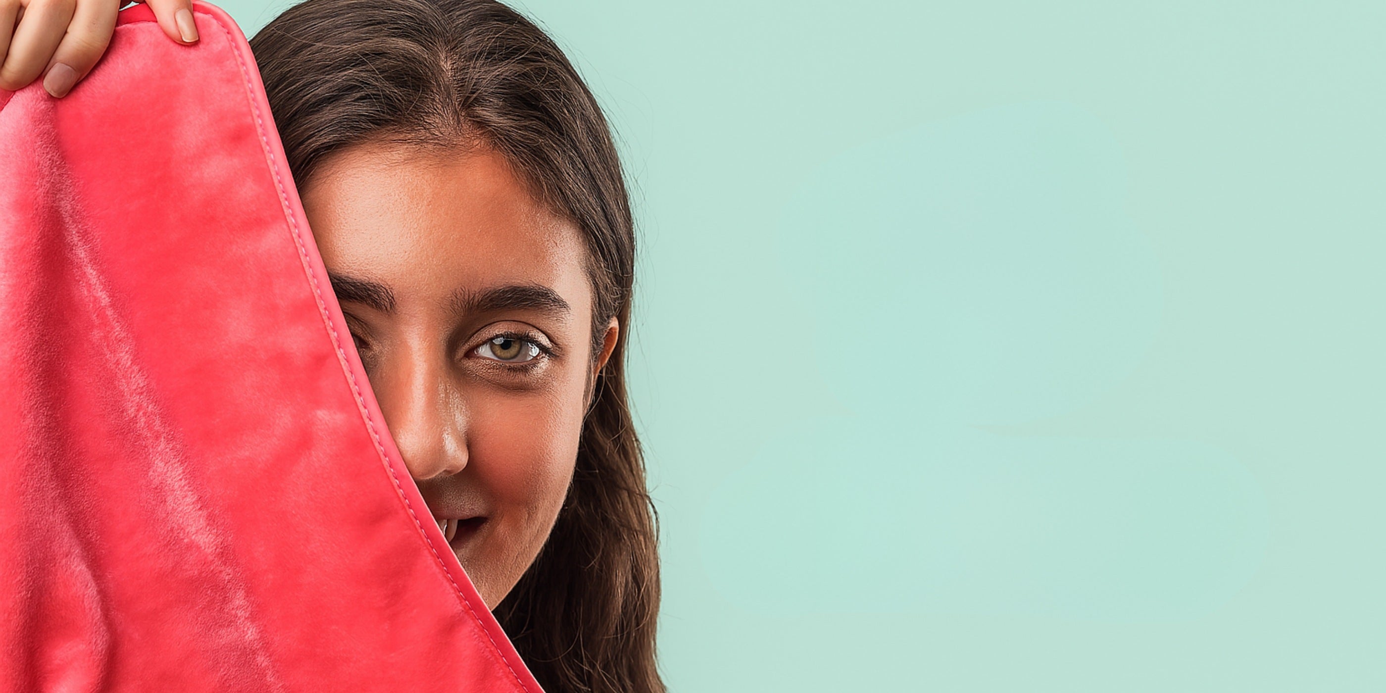 girl holding makeup removal towel