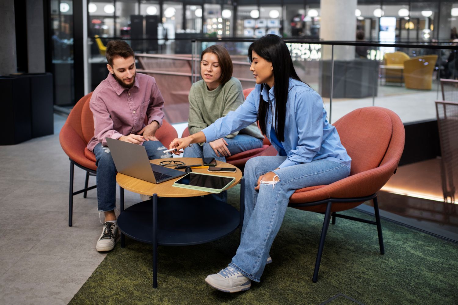 Business team using high-speed internet in a modern office – professionals collaborating on laptops with reliable Wi-Fi connection for corporate use