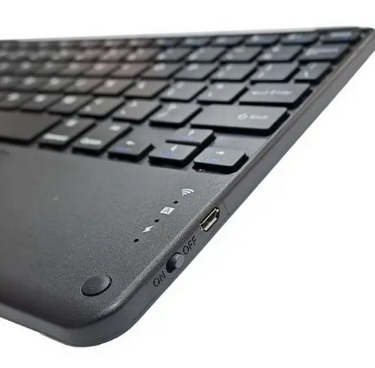 Black keyboard with power and USB ports on a white background