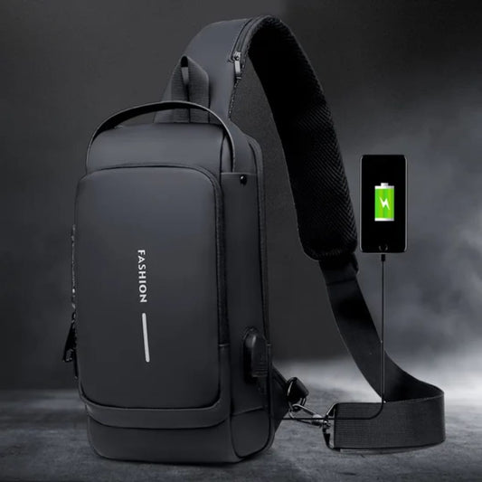 Black shoulder bag with USB port and smartphone charging on a dark background