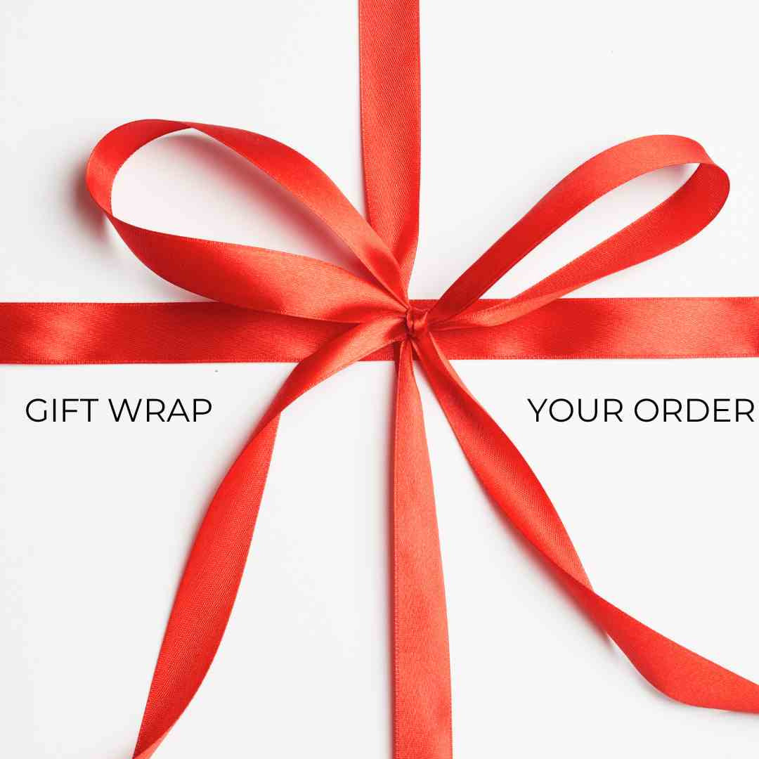 Red gift wrap with a large bow on a white background